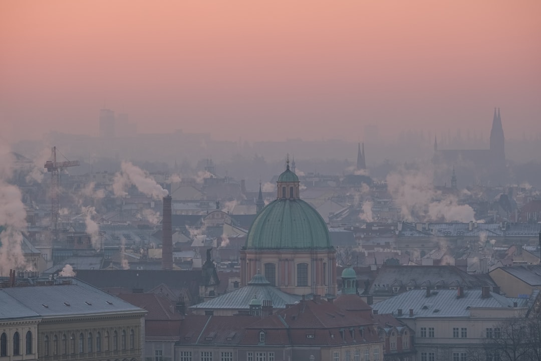 a view of a city with a lot of smoke coming out of it